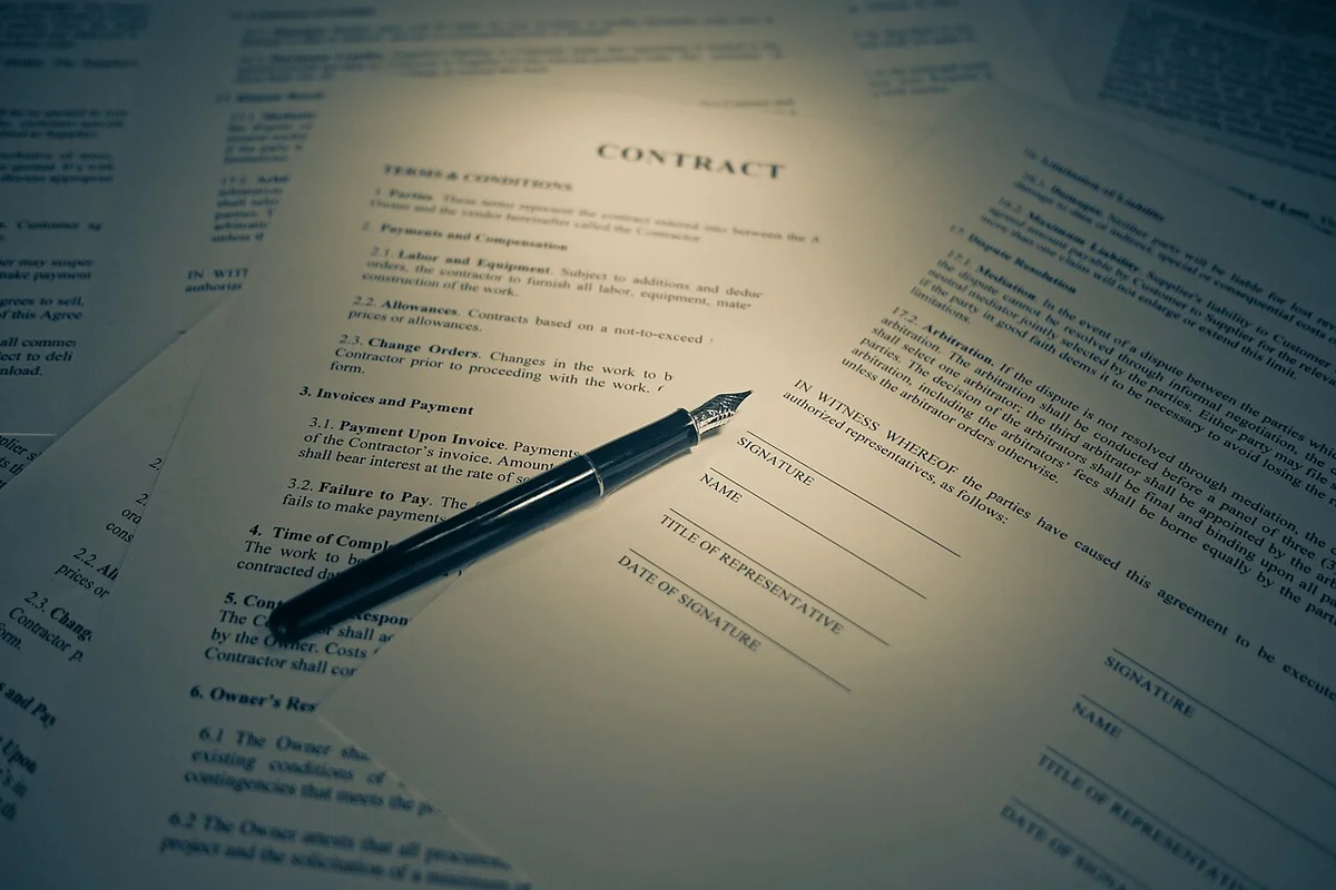 Formal printed authorization letter document with pen on signature line for proxy parcel release.