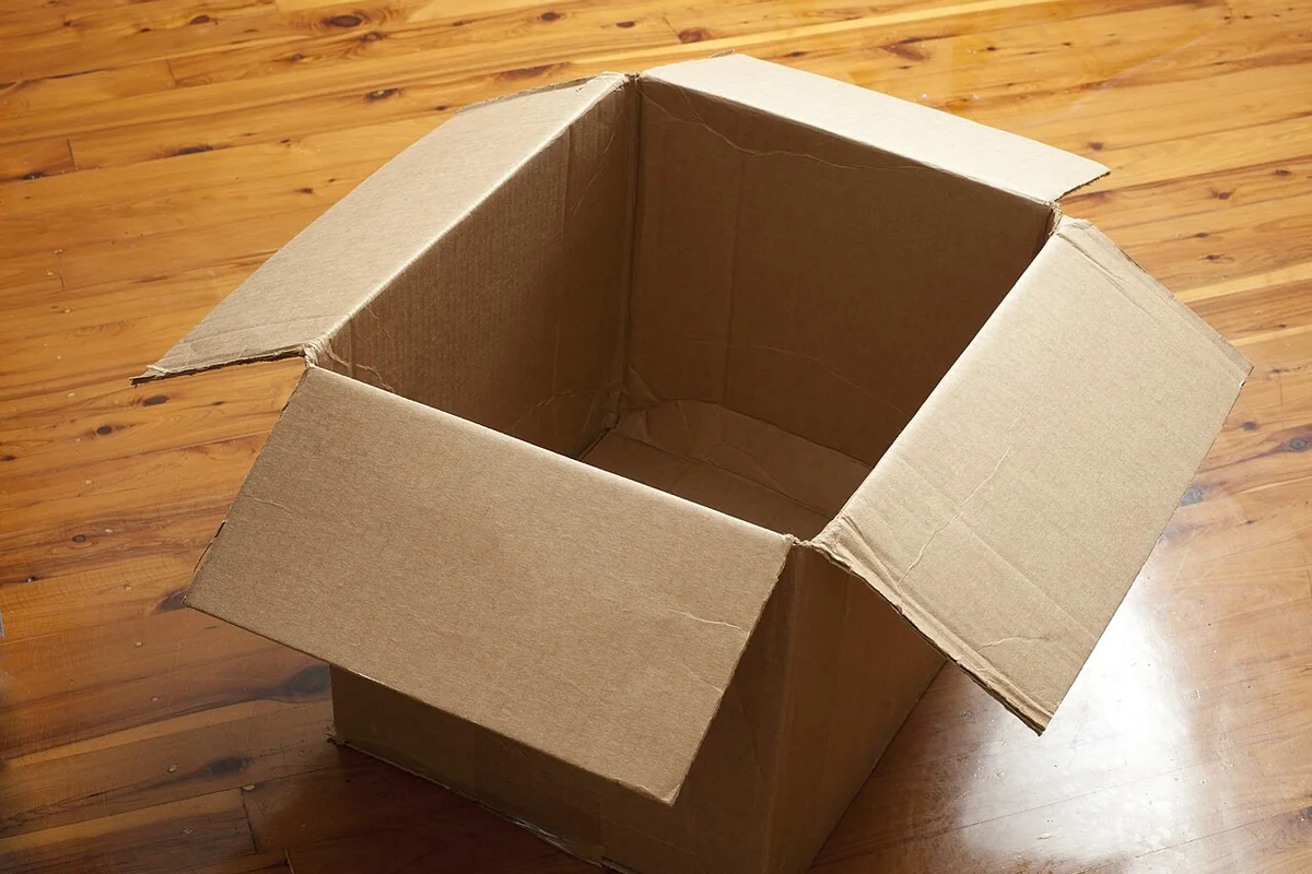 Stack of durable corrugated cardboard shipping boxes used for courier package transport.