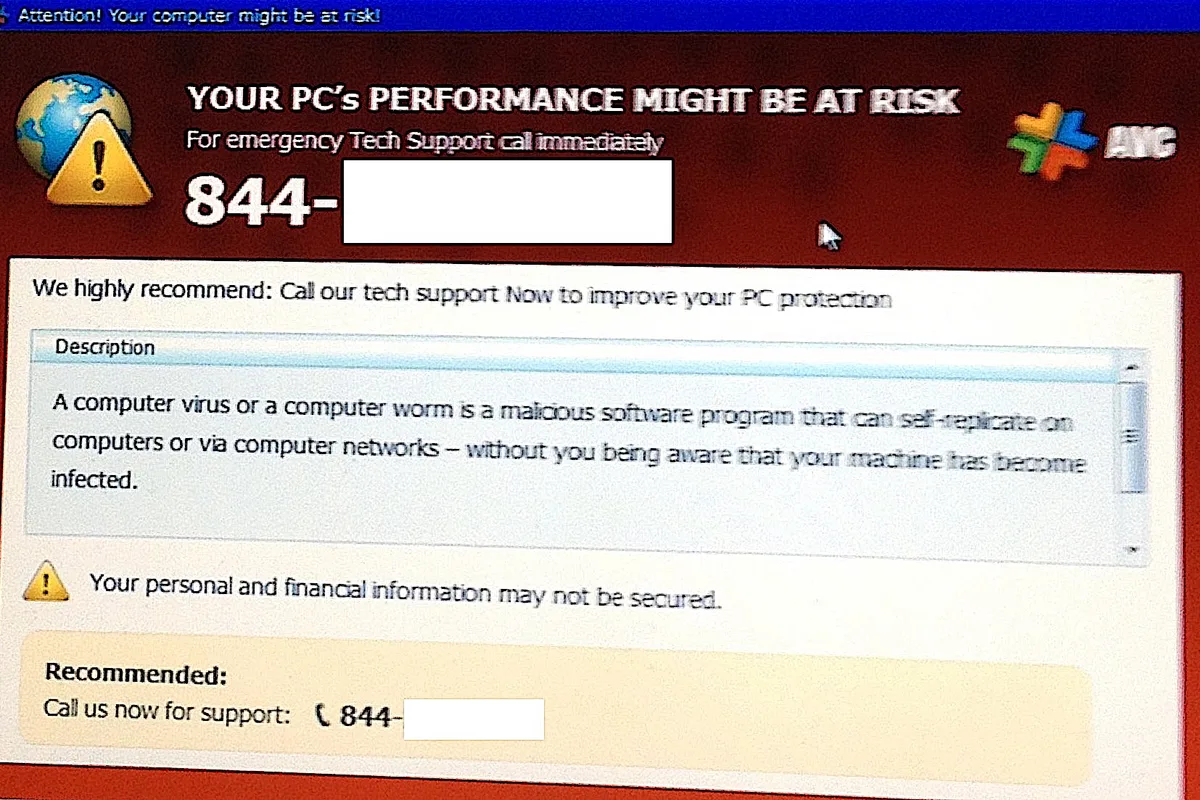 Computer screen showing a fraudulent security warning alert, demonstrating online scam tactics