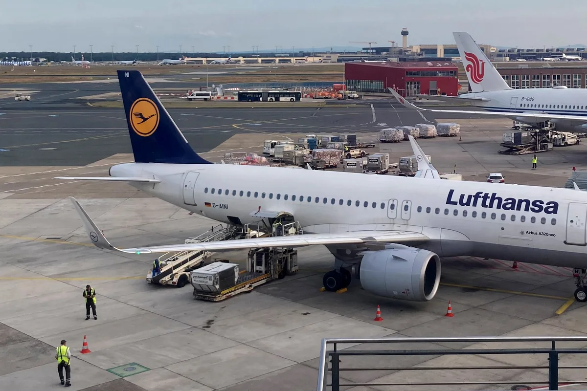 Commercial air cargo freight ground handling and container loading at airport ramp