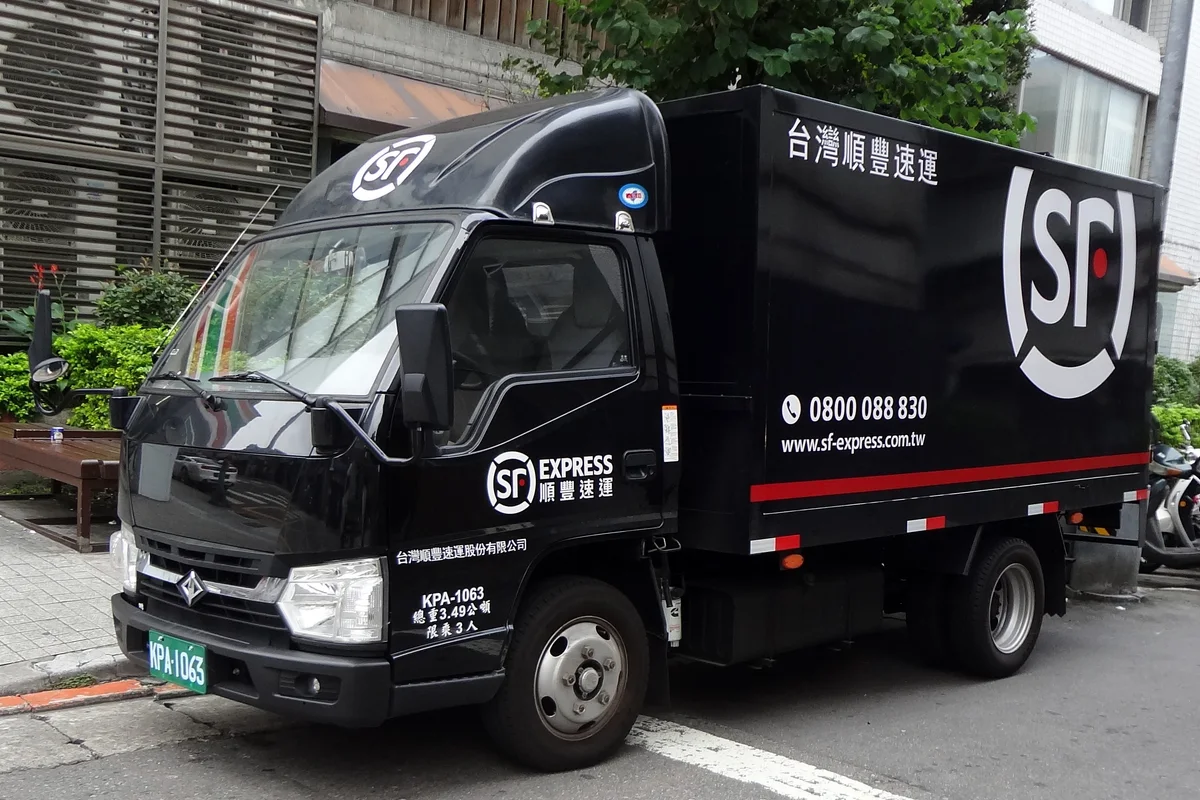 Express courier delivery van transporting e-commerce packages on urban delivery route
