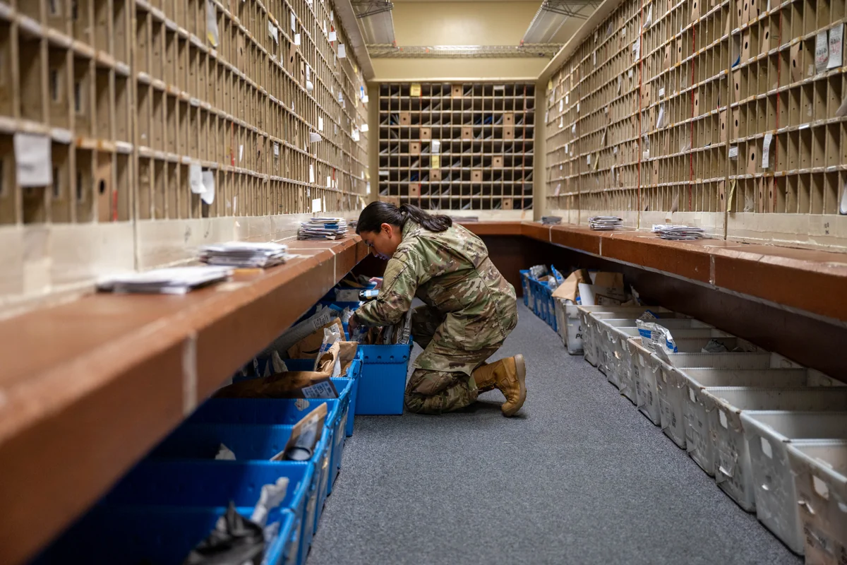 Packages sorted on warehouse staging shelves held for address verification