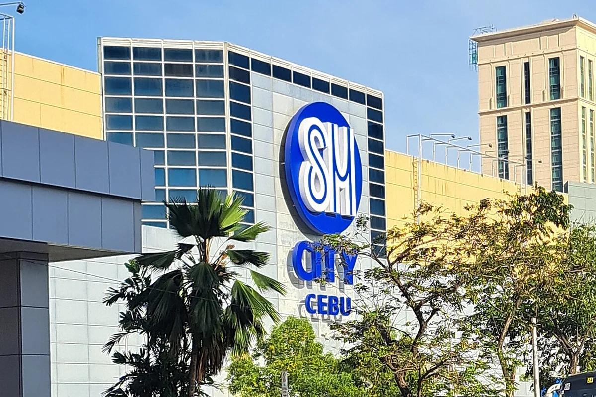 Exterior facade of SM City Cebu shopping center where mall-based courier branches remain open for Sunday parcel drop-offs and branch pick-ups.