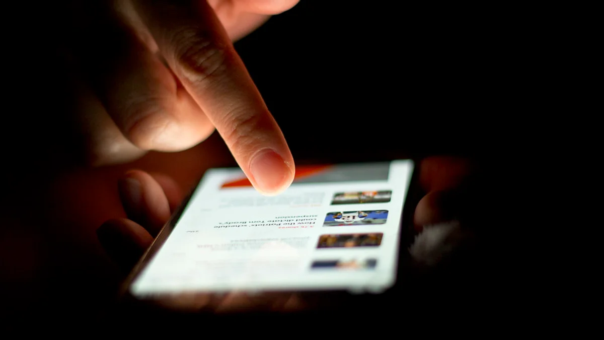 Recipient checking weekend tracking status and delivery updates on a mobile smartphone.